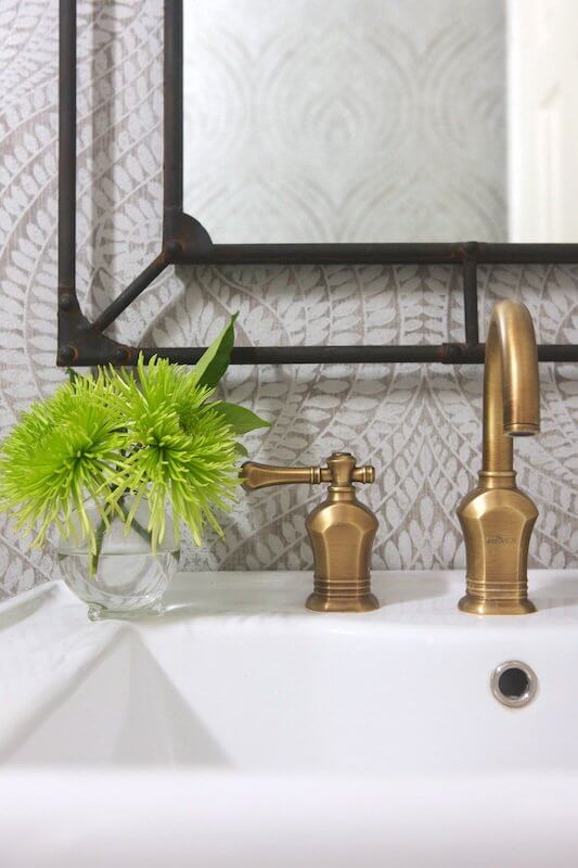 "I love the juxtaposition of a pretty wallpaper with the masculine metal mirror," says Marianne. Image: Beth Hontzas