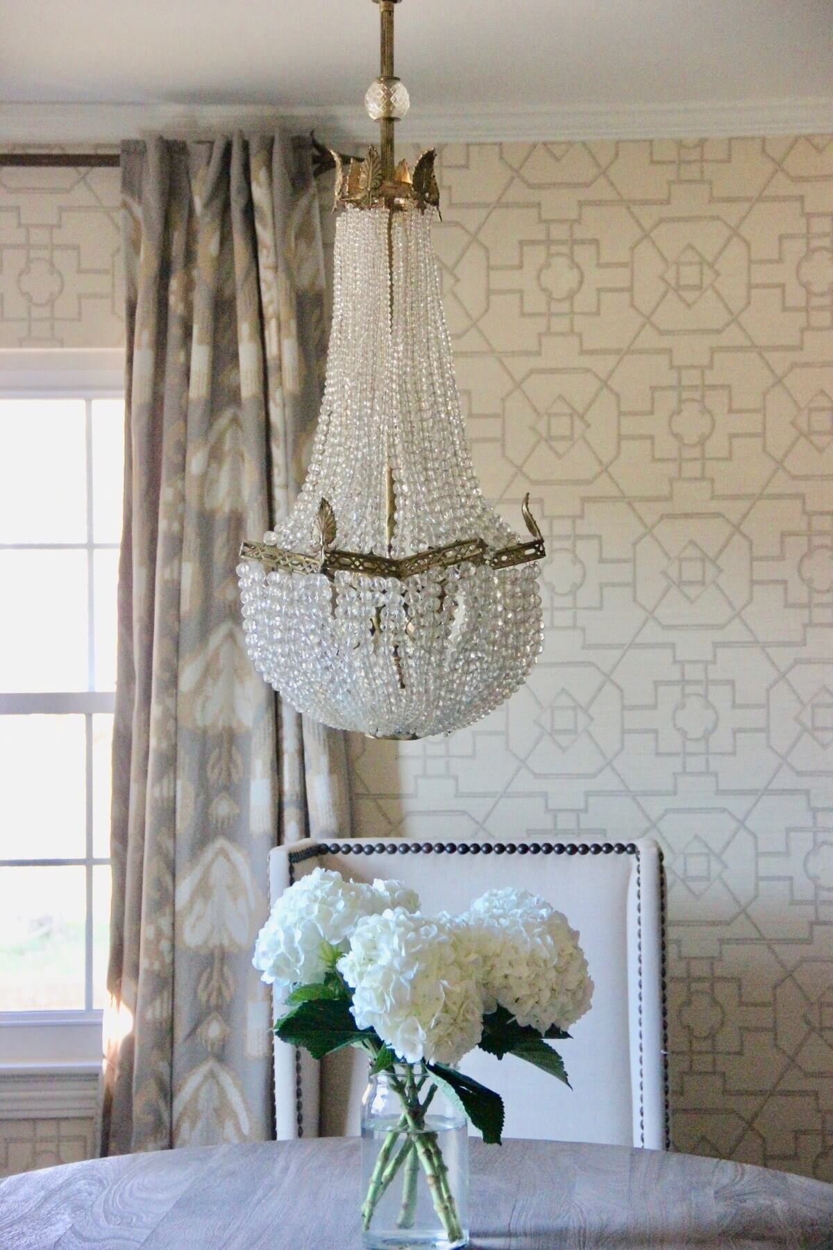"That is an antique chandelier that my dad got years and years ago, and I’ve been hoarding it and carrying it for years and years, and I finally found the perfect space for it in my dining room," says Marianne. "And I knew immediately that I wanted to use that wallpaper." Image: Marianne Strong