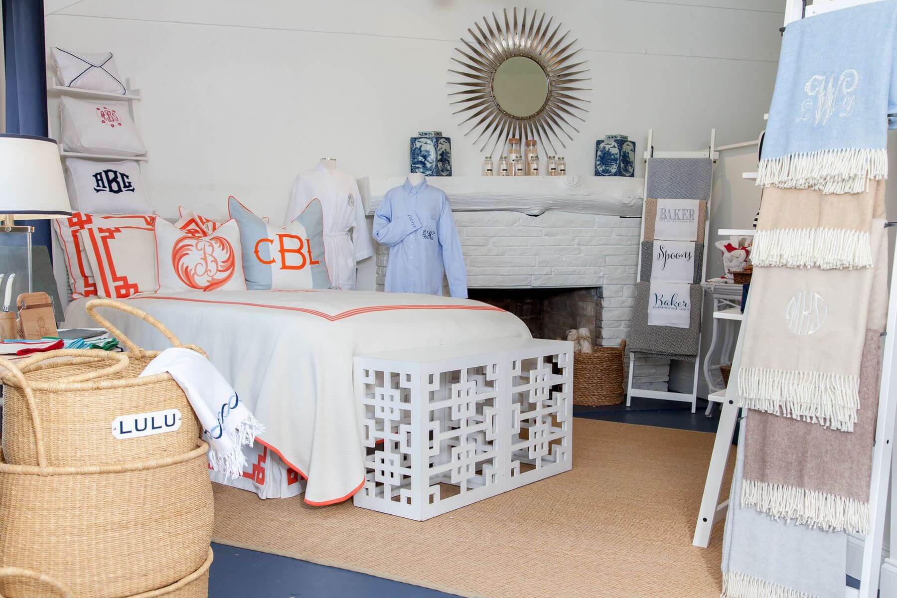 monogrammed pillows on bed