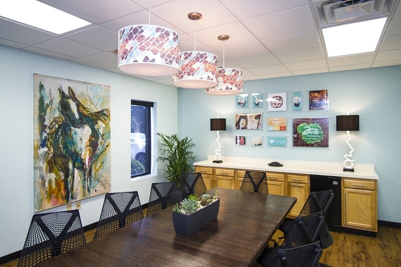 The use of bright colors and fun patterns add a whimsical element to the office. Image: LL&A