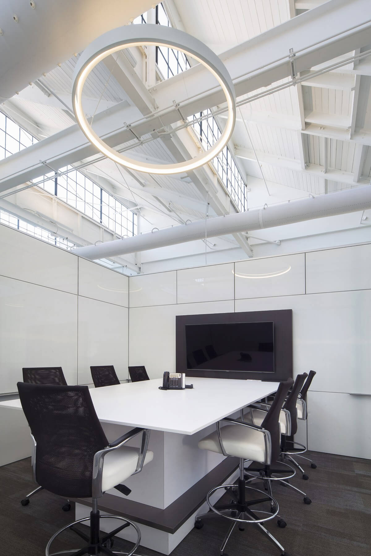 Unique circular lighting makes a simple yet stunning statement in this one-of-a-kind conference room. Image: Mason Fischer Unique circular lighting makes a simple yet stunning statement in this one-of-a-kind conference room. Image: Mason Fischer