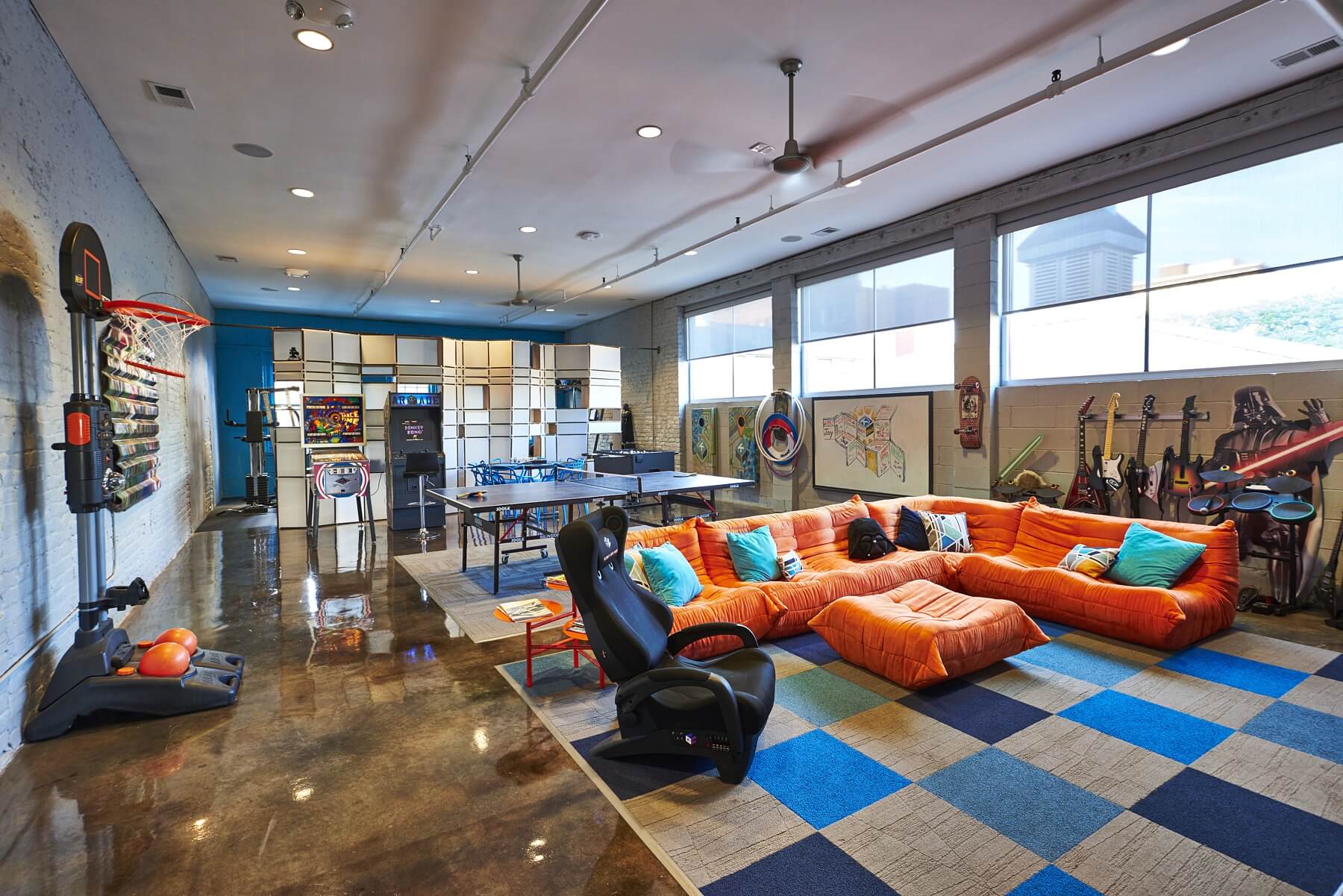 The game room with exercise room in the back, also features guitars, drums, pin ball machine, a arcade game machine that includes every arcade game ever invented, a ping-pong table, a state-of-the-art e-basketball hoop and a game center that has everything from Atari and Nintendo to the late-breaking games. Image: Edward Badham The game room with exercise room in the back, also features guitars, drums, pin ball machine, a arcade game machine that includes every arcade game ever invented, a ping-pong table, a state-of-the-art e-basketball hoop and a game center that has everything from Atari and Nintendo to the late-breaking games. Image: Edward Badham