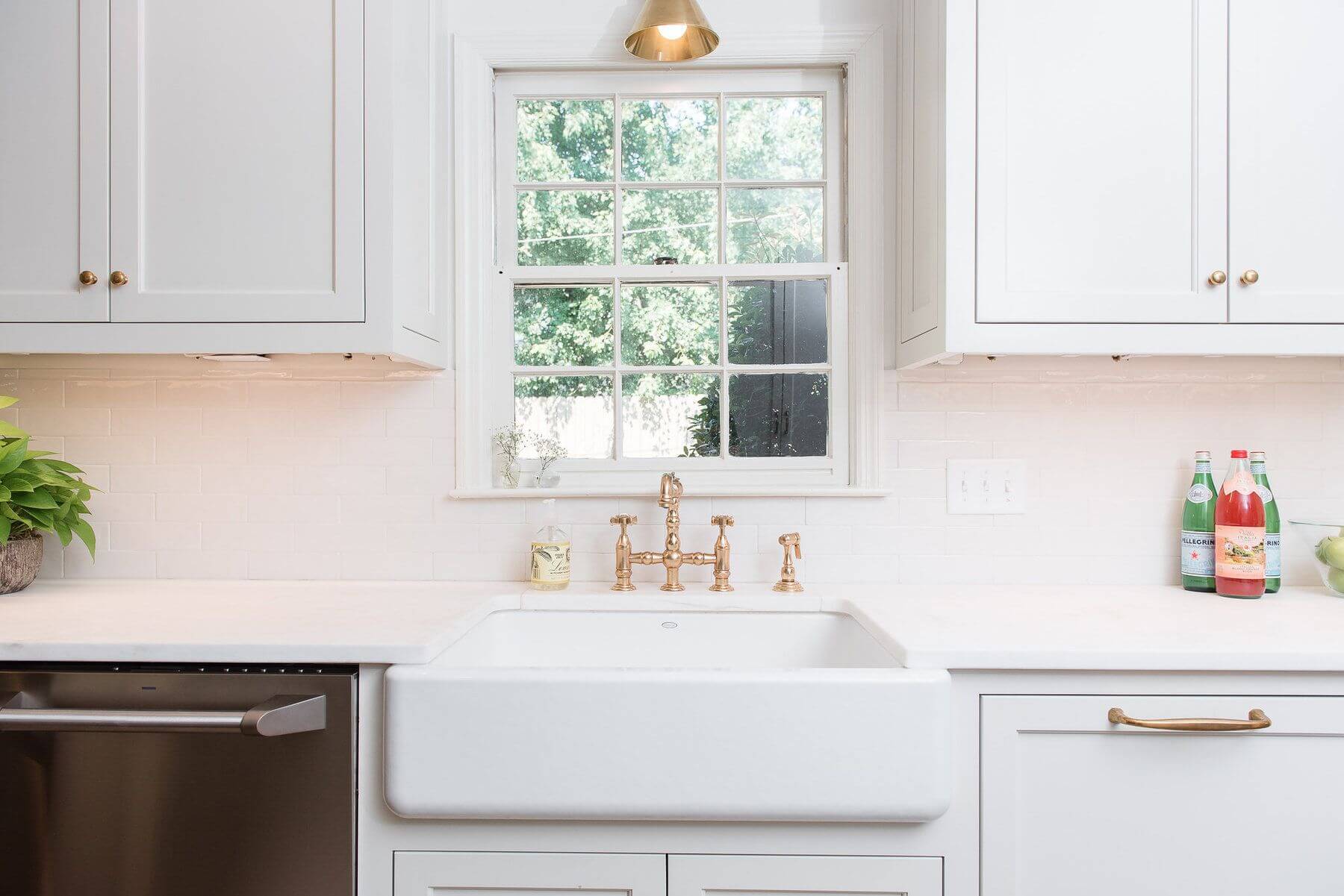Aged brass from Architectural Heritage provides a timeless feel to the new kitchen.