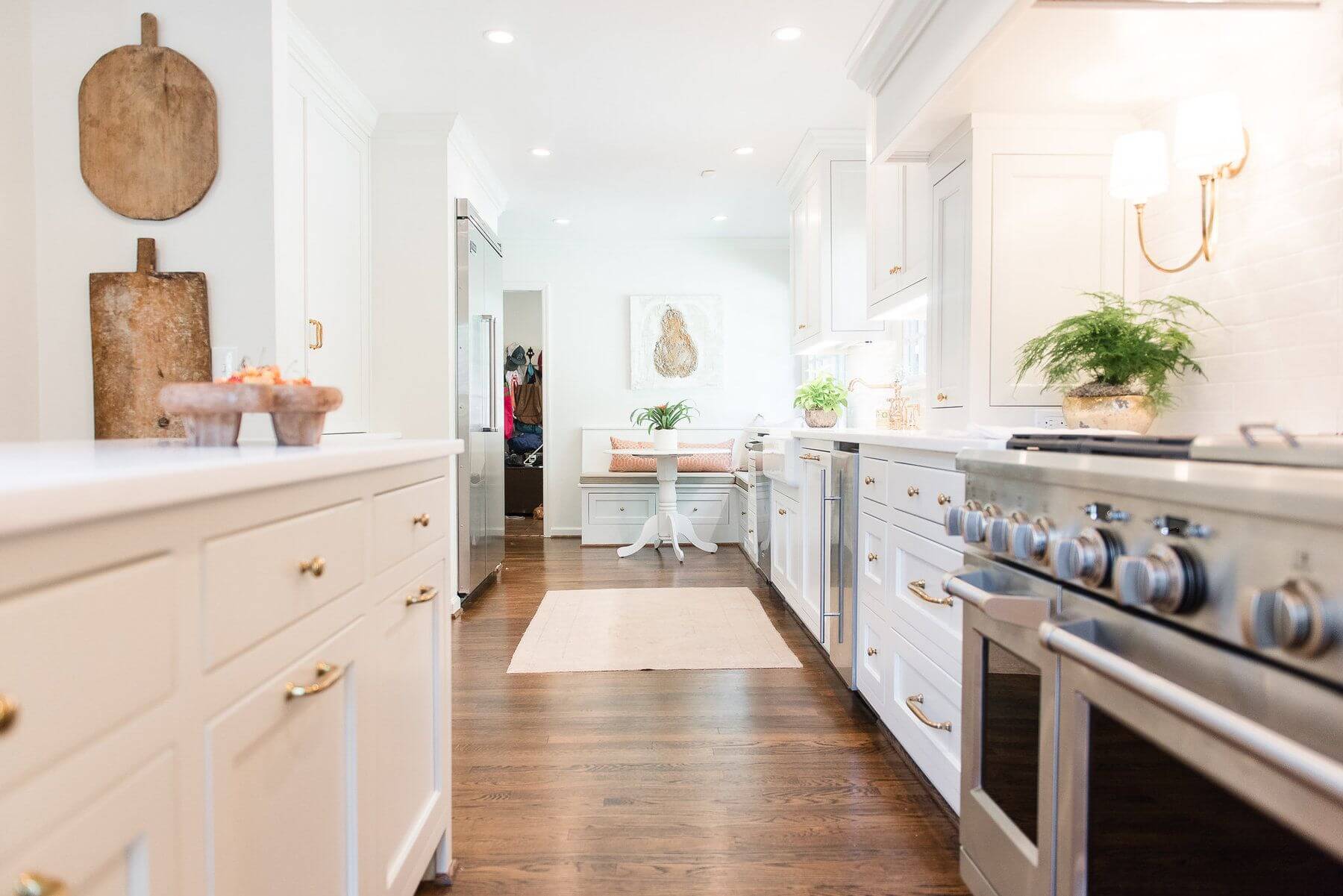 In her new kitchen, Ashley can be with her kids as she cooks, while they do homework at the banquette or hand out at the kitchen island.