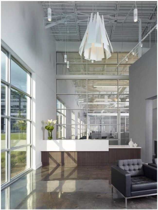 New windows and large expanses of interior glass help to flood the interiors with natural light and allow a layering effect with views from the main lobby through into the office spaces. Image: Luker Photography New windows and large expanses of interior glass help to flood the interiors with natural light and allow a layering effect with views from the main lobby through into the office spaces. Image: Luker Photography