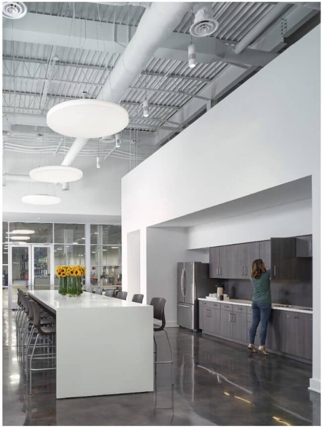 Town Hall gathering space, with views into the production area, bring office staff and production staff together in the heart of the building. Image: Luker Photography Town Hall gathering space, with views into the production area, bring office staff and production staff together in the heart of the building. Image: Luker Photography