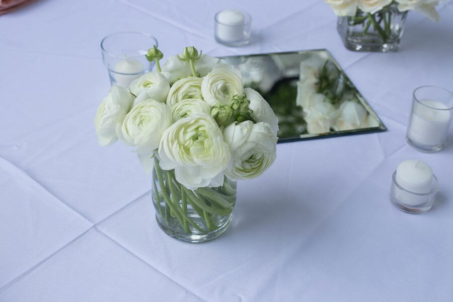 Each table came complete with peonies, ranunculus, hydrangeas, and white spray roses. Each table came complete with peonies, ranunculus, hydrangeas, and white spray roses.
