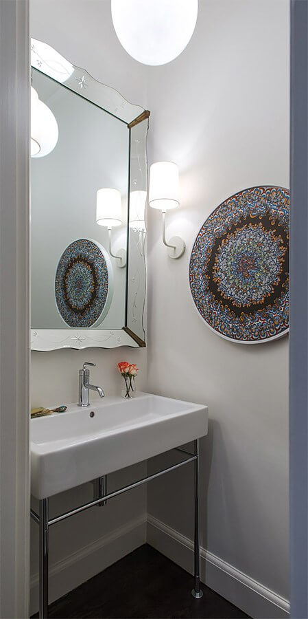A simple design allows the art to command the attention in the powder room. Check out these Powder Rooms