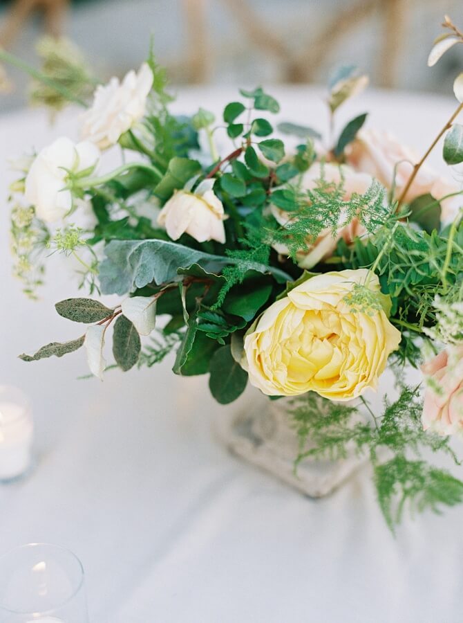 The florist chose colors outside of the white and green color palette to add depth to the arrangements. 