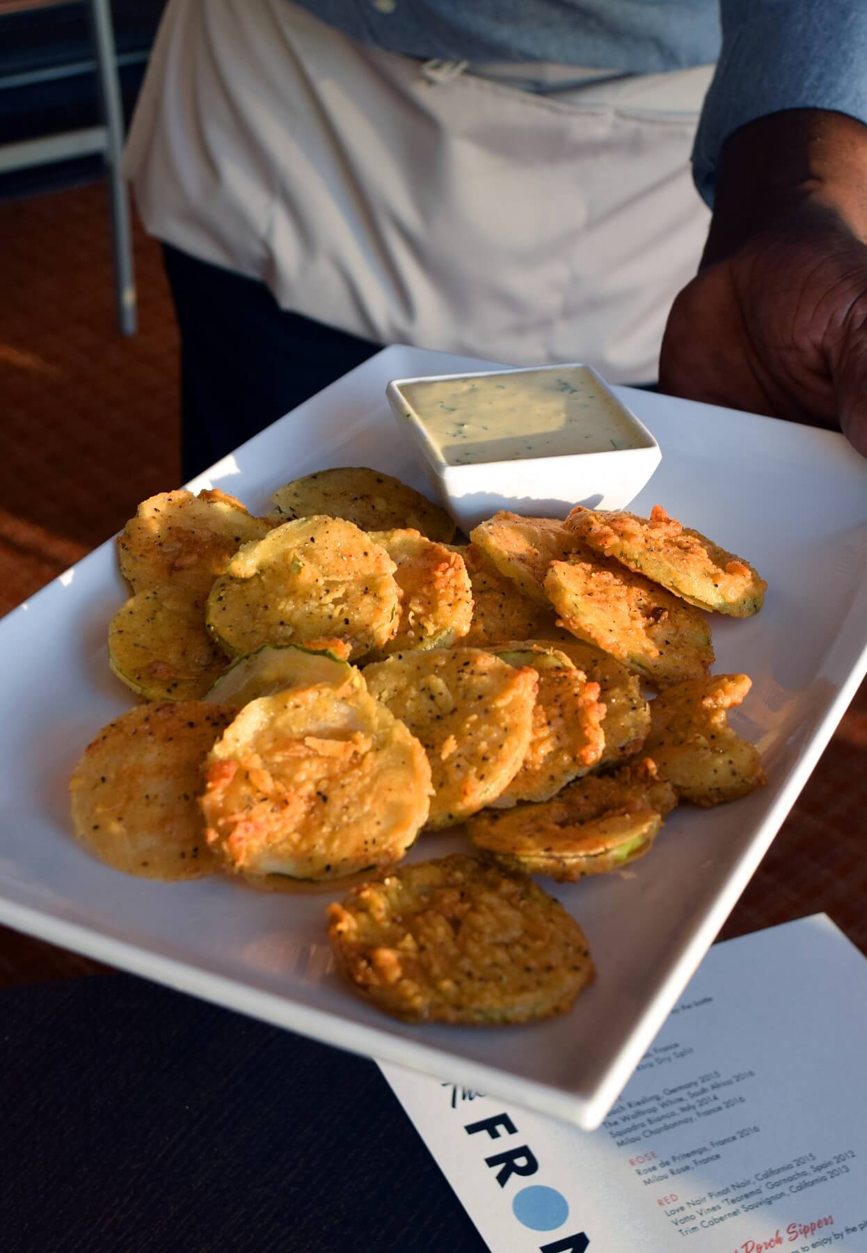 The fried pickles at The Front Porch are the perfect snack to share with friends as you watch the sun set over the Mississippi River.