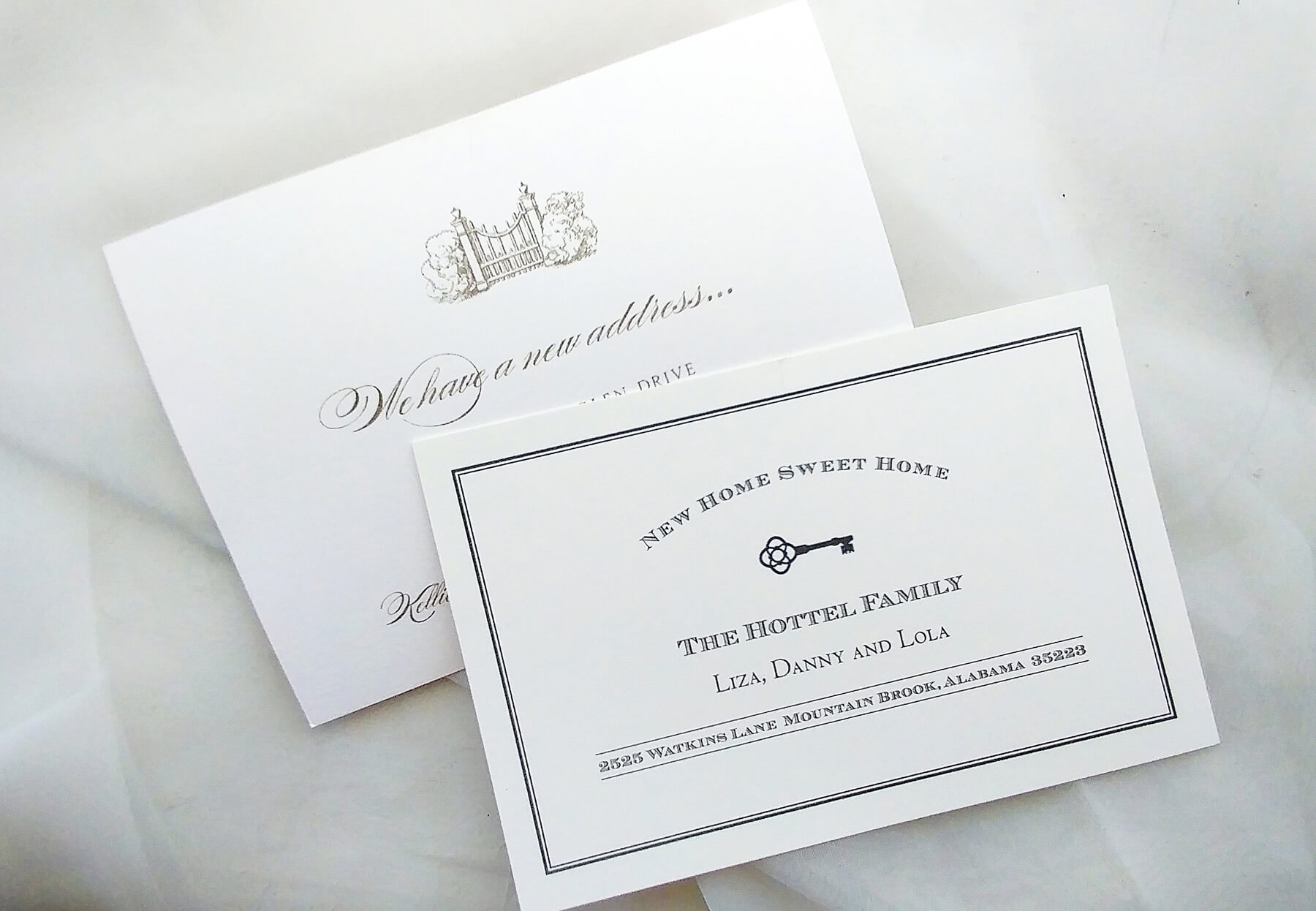 A tasteful rendering of a gate or a key are old-school graphics classically used to announce a move. stationery