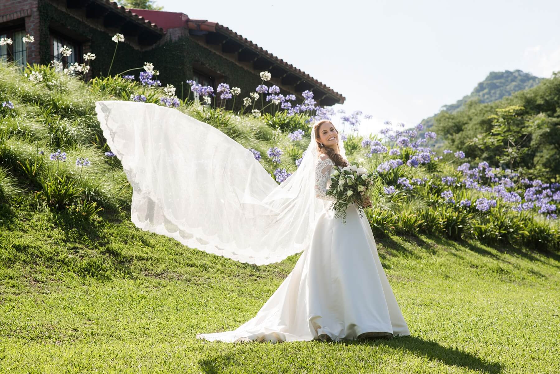 The beautiful bride poses on what she calls Juan’s hill. Three houses that belong to Juan’s family are situated on this stunning hillside in Salta. Argentina Wedding