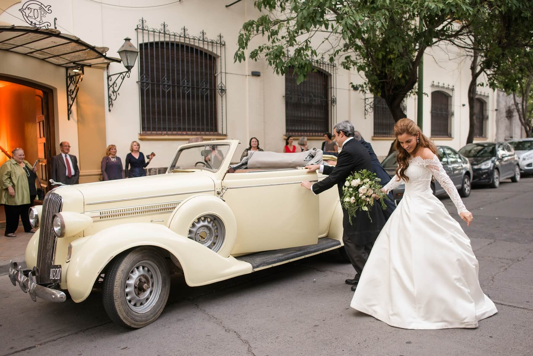 Sarah Kate and Juan arrive at their reception, chauffeured by Juan’s Uncle Gerardo in a family-owned vintage Dodge that he kindly restored for the bride and groom. “Originally, he planned to drive us in Juan's grandfather's old 1930s Cadillac,” Sarah Kate says. “The car was perfectly restored and ready, but on the big day, it did not start! Fortunately, Gerardo had this other antique Dodge coupe, and it was a lot of fun to be in an antique convertible and, in the end, matched the church and everything else so beautifully!” Argentina wedding