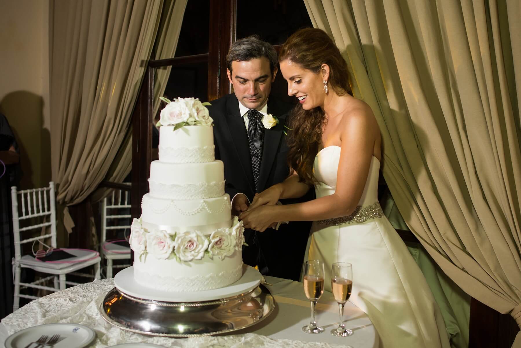 As tiered wedding cakes aren’t commonly seen at Argentinian weddings, Sarah Kate had a difficult time finding a vendor in Salta who could create a cake for her. “I really wanted to have that moment of cutting the cake at my wedding,” Sarah Kate says. “My favorite photo of my parents from their wedding is them cutting the cake.” She found a baker who made a gorgeous four-tiered wedding cake featuring chocolate, red velvet, and dulce de leche, adorned with lace and blush roses. Argentina wedding
