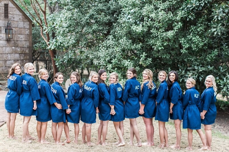 Miller and her bridesmaids spent the morning of the wedding getting ready in these personalized robes at Miller’s childhood home. So sweet!