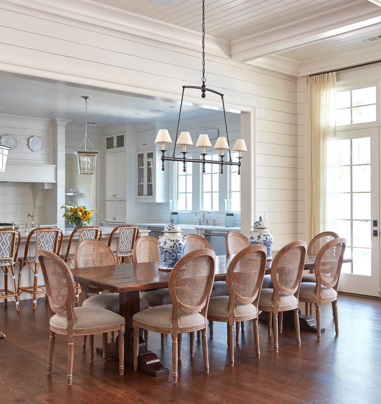 The breakfast room table and chairs are from Scott’s Antique Market, and seat 10 people comfortably. Shiplap on surrounding walls cozies up the tall ceilings.
