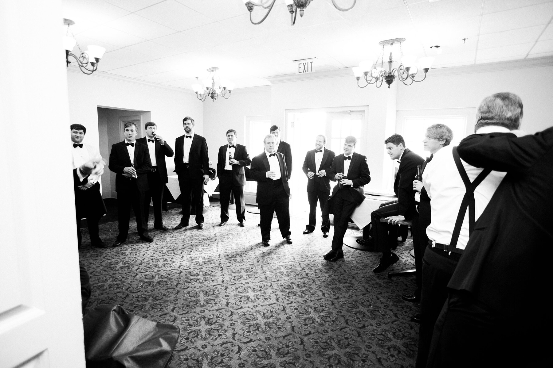 The guys take a breather — and a quick sip or two — before the ceremony begins.