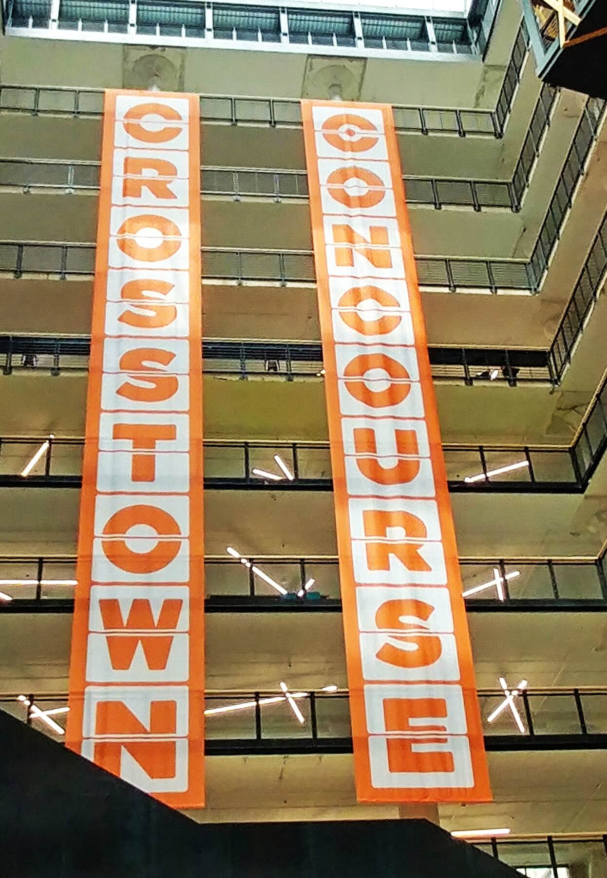 Banners emblazoned with the Crosstown Concourse signature colors and logo proudly announce the new development. Crosstown Concourse — Banners emblazoned with the Crosstown Concourse signature colors and logo proudly announce the new development.