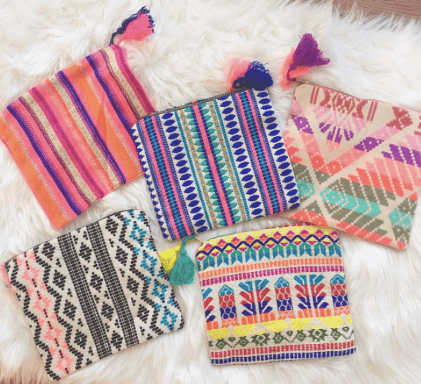 Don't miss Boho Bus's collection of accessories. These punchy pouches are perfect for makeup and serve double use as a clutch.