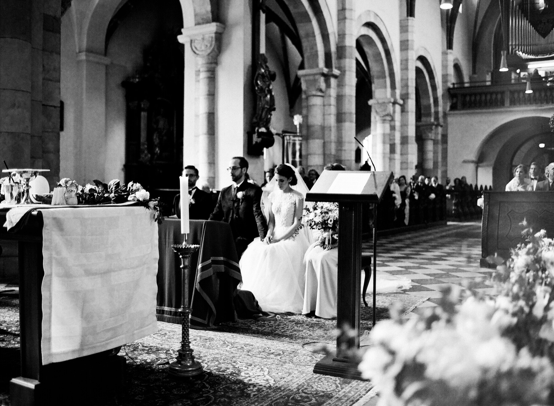 Kelli and René are seated during the mass.