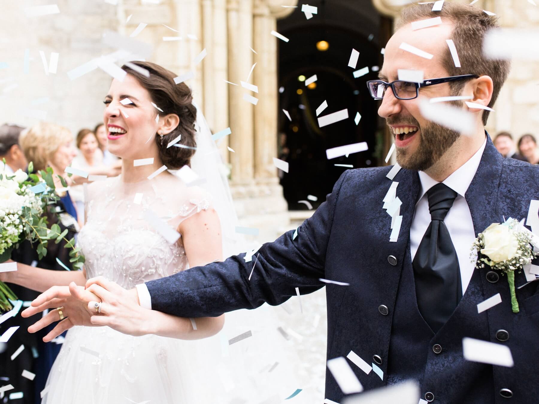 Mr. and Mrs. Hinteregger enjoy a moment of wedded bliss among a flurry of confetti and cheers from friends and family.