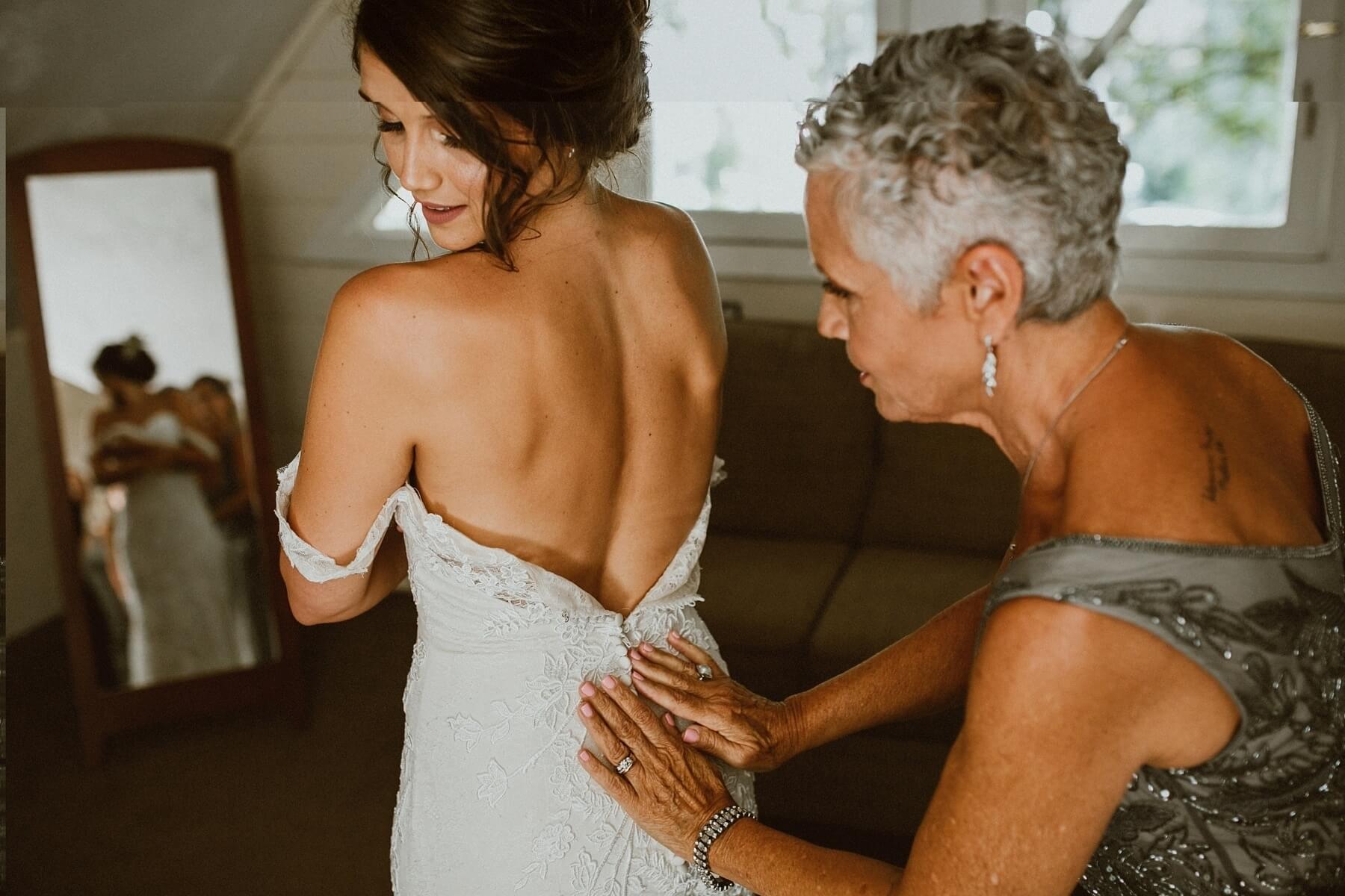 Martha found her gown at BHLDN in Beverly Hills. “I really wanted a dress that felt earthy, bohemian and causal but formal. I didn’t want anything super fancy, I’m not a ball gown kind of a girl,” Martha says. “I wanted a really romantic feeling dress, so I ended up going to BHLDN and they showed me this dress, with floral-looking lace and we could add a Juliet sleeve, and I just fell in love with it.”