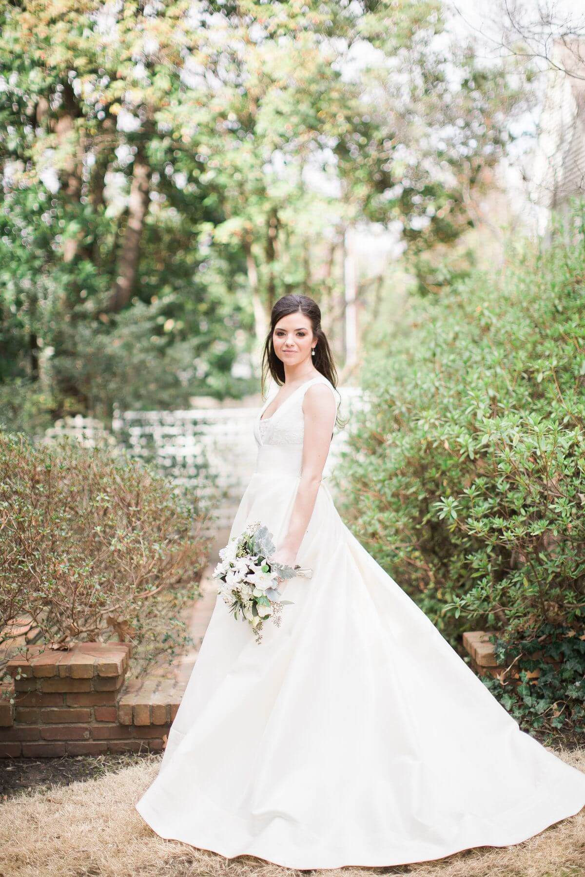 Posing amid the greenery in the backyard of her childhood home, Miller is the very picture of a quintessentially Southern bride — elegant, beautiful, timeless.