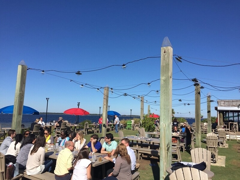 Tables and games al fresco are part of the charm at Red Fish Blue Fish.