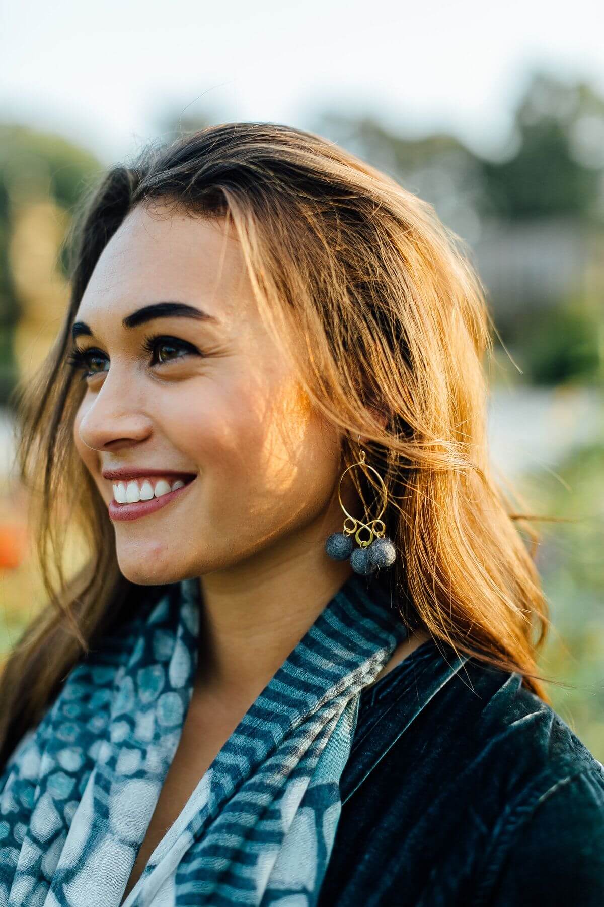 These felt bauble earrings add an aura of whimsy to a sophisticated look.