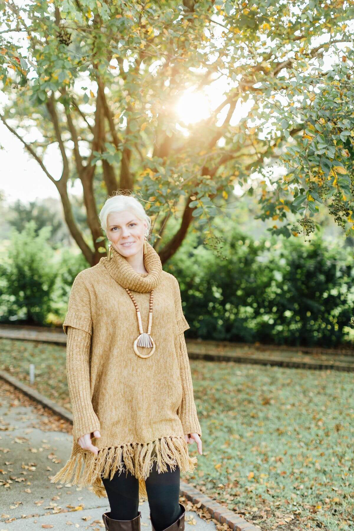 On Kelli, from Coming Attractions: Hem & Thread sweater, $92; Hearne Dry Goods Grand Canyon necklace, $178; Gold tassle earrings, $72; Lysee leggings, $78