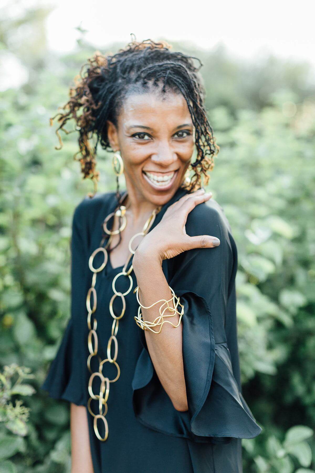 Gold jewelry adds an element of glamour to this little black dress.
