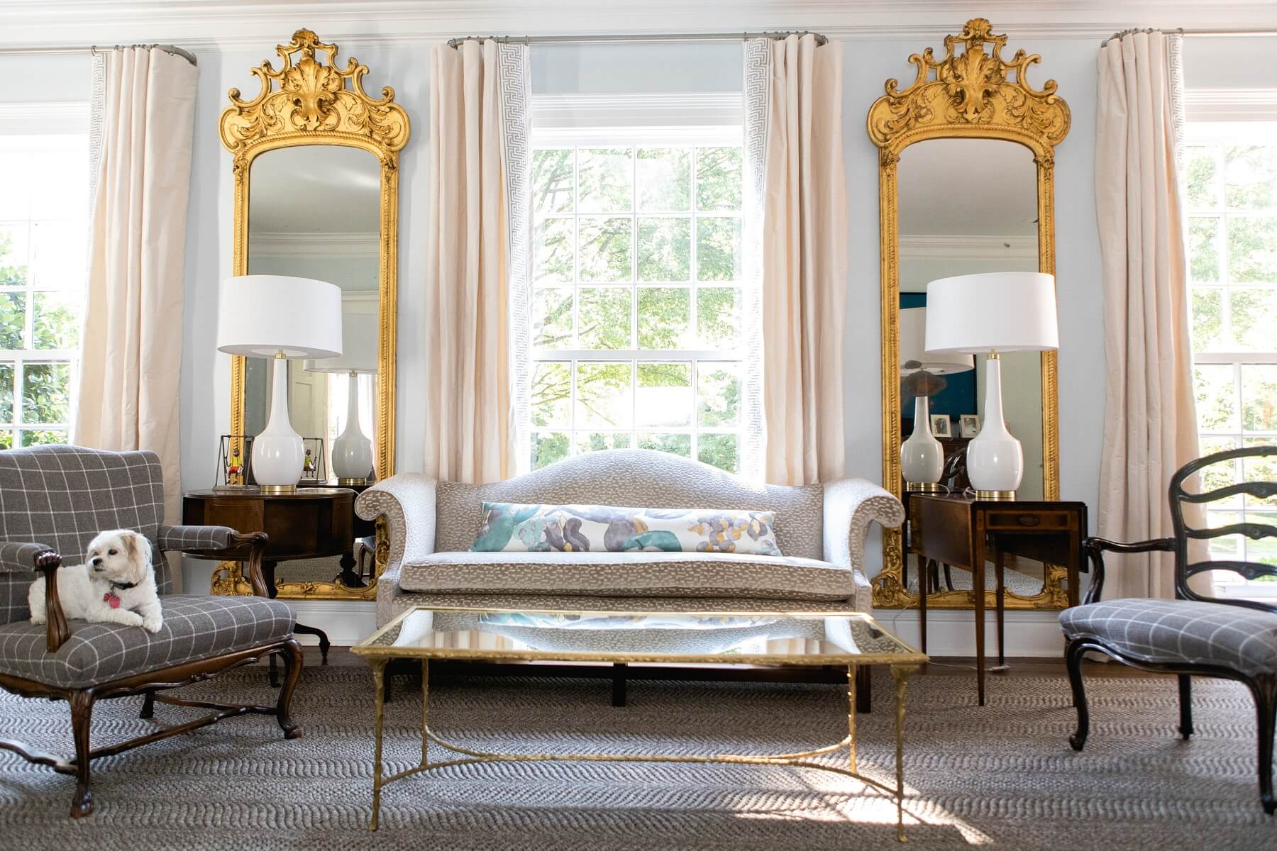 Rachel moved these gorgeous gold antique mirrors, original to the home, to the grand living room.