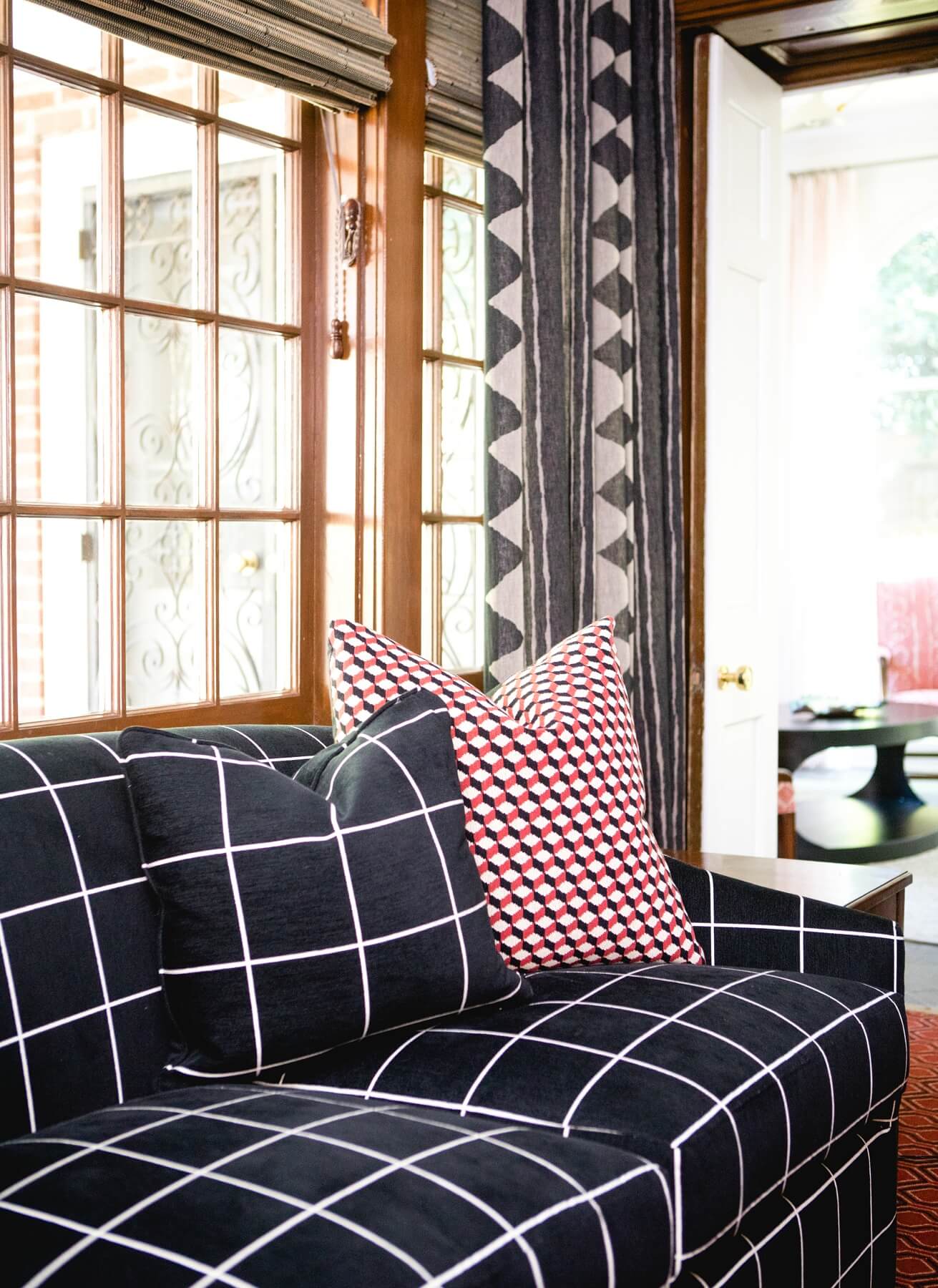 Geometric patterns in black, white and red make for a striking combination in this side room. Geometric patterns in black, white and red make for a striking combination in this side room.