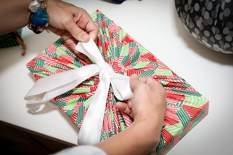 "If every American family wrapped just three gifts a year in reused materials, it would save enough paper to cover 45,000 football fields," Ashley explains. Her Lilywrap line is reusable and therefore eco-friendly.