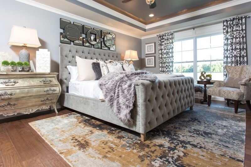 The printed rug and textured throw add a sense of comfort and dimension to this master bedroom. Image: LL&A Interior Design The printed rug and textured throw add a sense of comfort and dimension to this master bedroom. Image: LL&A Interior Design