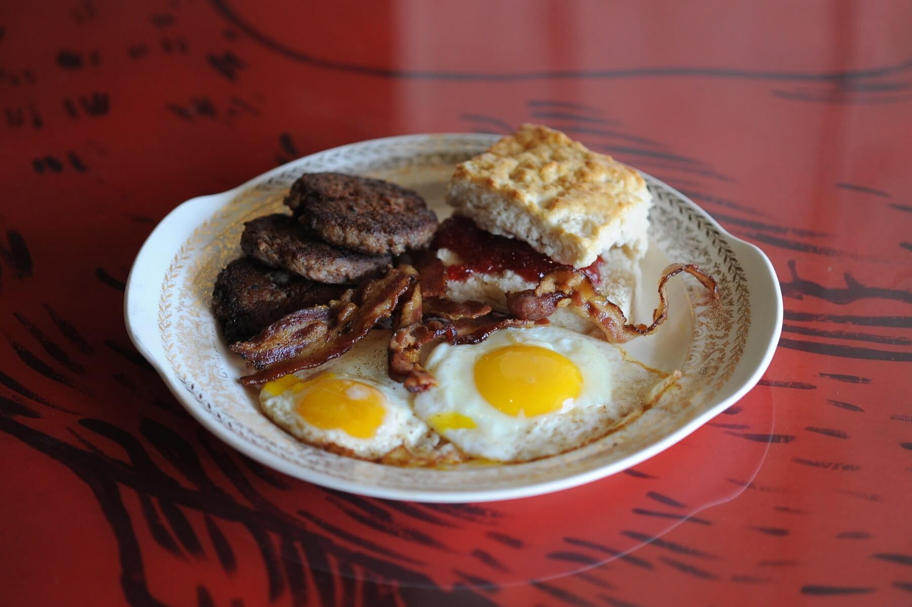 The Kitchen Sink Platter has a little of everything you love about breakfast: eggs, sausage, bacon, hash browns, biscuits and grits. Image: Sunrise Memphis Sunrise Memphis