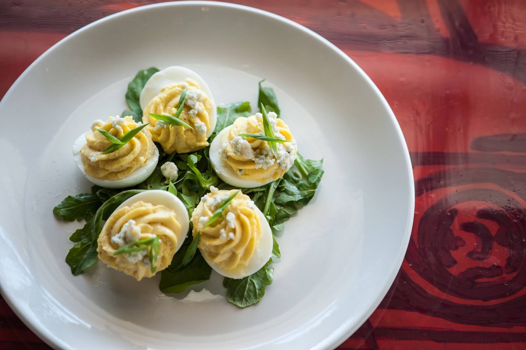Take your holiday deviled eggs up a notch like Chef Ryan Trimm of Sweet Grass. His creamy and savory twist on this Southern classic contains roasted pumpkin puree! Image: Sweet Grass holiday recipes