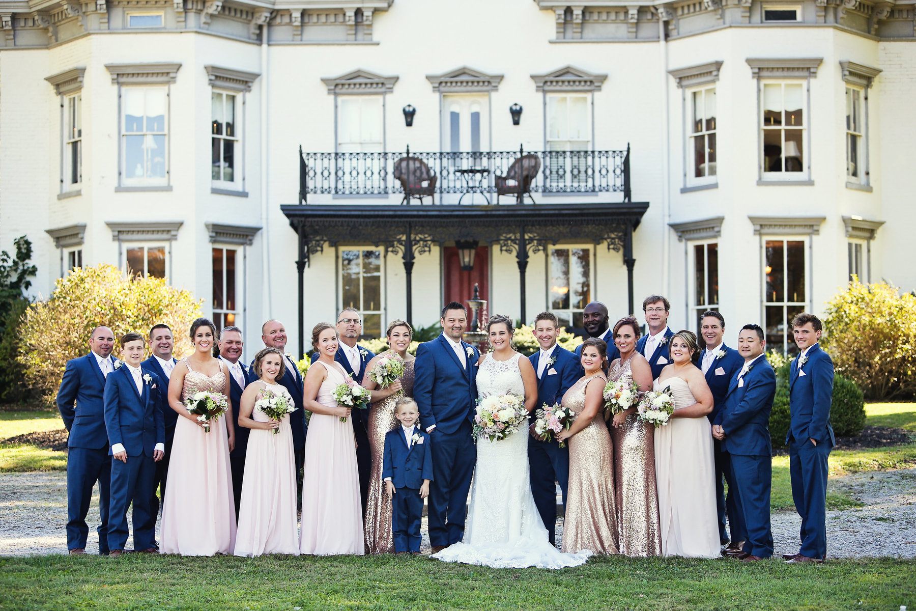 The wedding party gathers in front of the 200-year-old mansion in the sprawling grounds in Milton, Kentucky. Richwood on the River, a historic bed and breakfast and event venue, sits on the Ohio River, just across from Christian’s hometown of Madison, Indiana. Richwood on the River