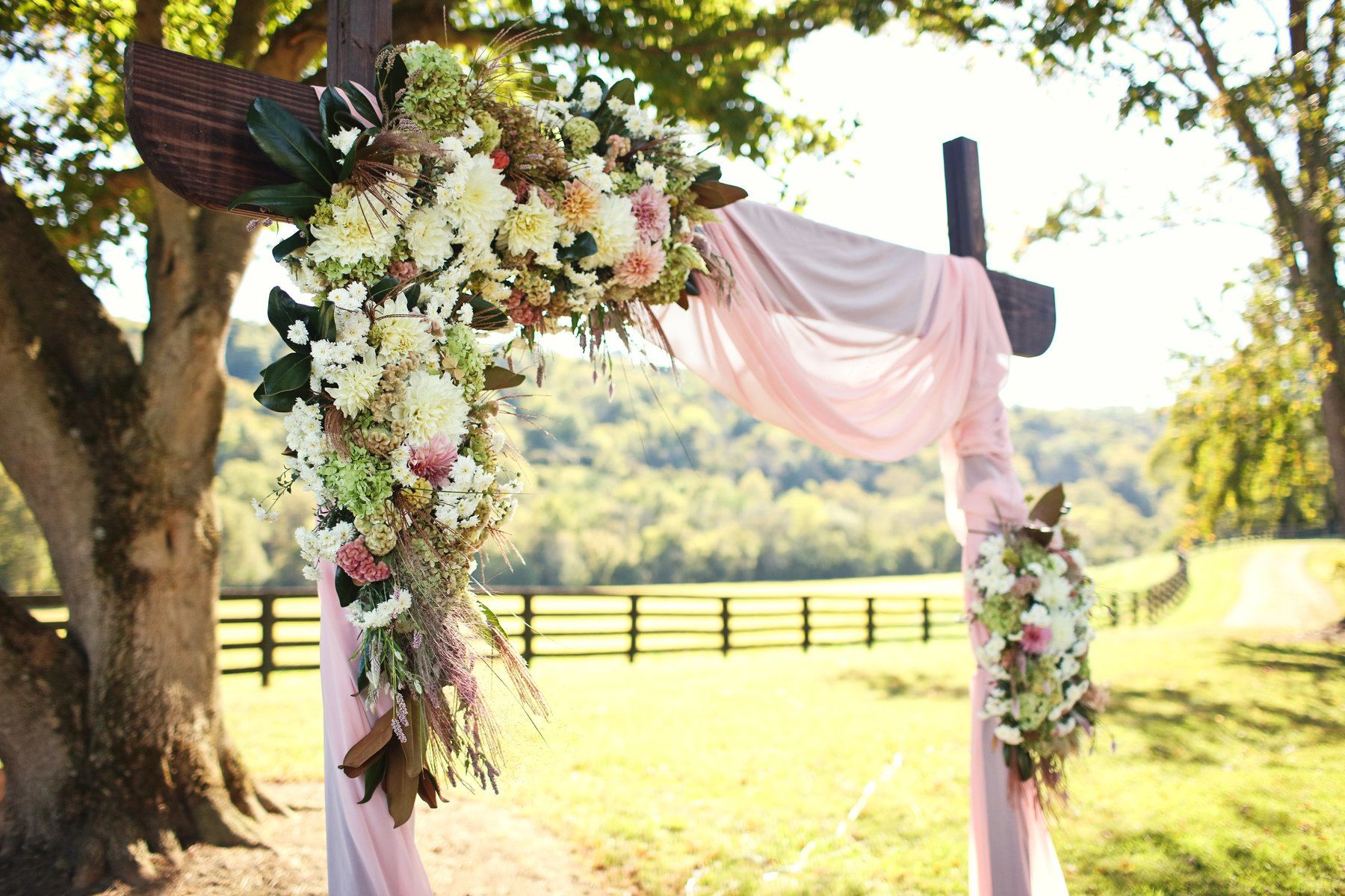The lush florals, designed by Hazelfield Farms, included dahlias and Austin roses and complemented their color scheme of blush and rose gold. Richwood on the River