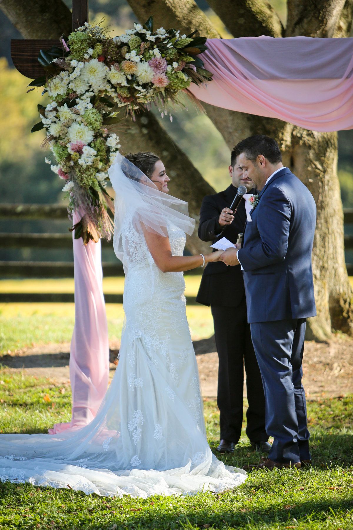 Sadly, both Christian’s mother and father passed away before they could meet their son’s bride, but Megan says she knows they were present during the ceremony. The slightest breeze blew on the happy couple while they recited their handwritten vows, gently wafting Megan’s veil and causing the blush fabric and florals to dance in the wind. “We could feel that Christian’s parents were there,” Megan remembers. “They both passed away before I met them, but I could feel them.” Richwood on the River