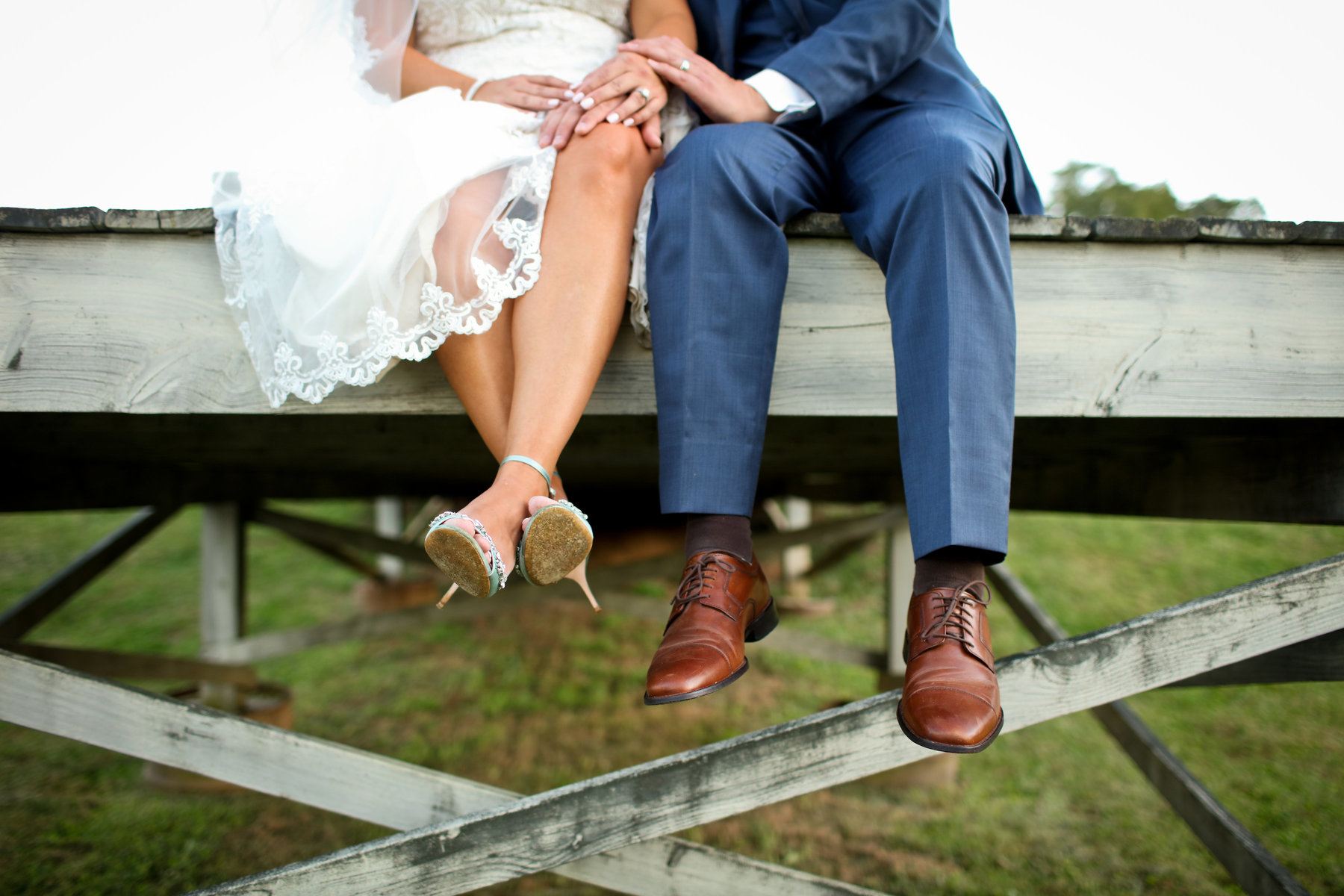 Megan’s baby blue heels counted for her “something blue.” Her something old? Christian’s sister made a handkerchief out of one of their mother’s old shirts, and Megan carried the sentimental fabric, embroidered with a letter “C,” around her wedding bouquet. Richwood on the River