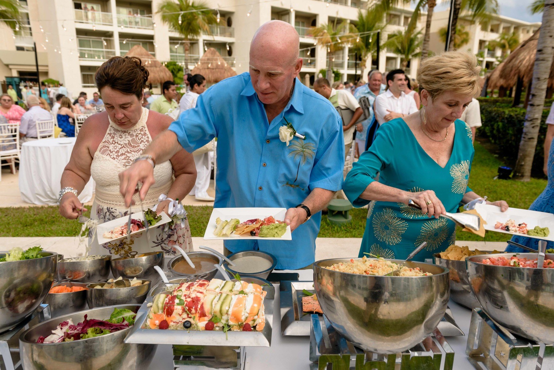 Guests dined on a buffet that included chicken, beef tenderloin, and fish, along with fresh salads and a dessert bar.