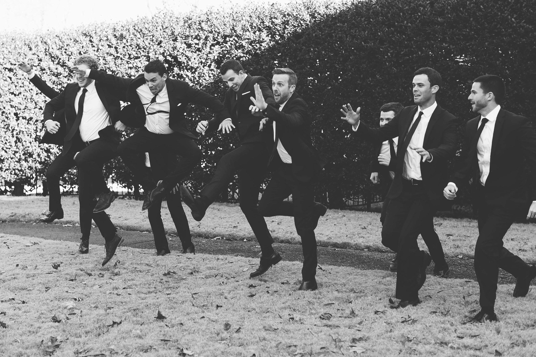 The handsome groomsmen goof off.