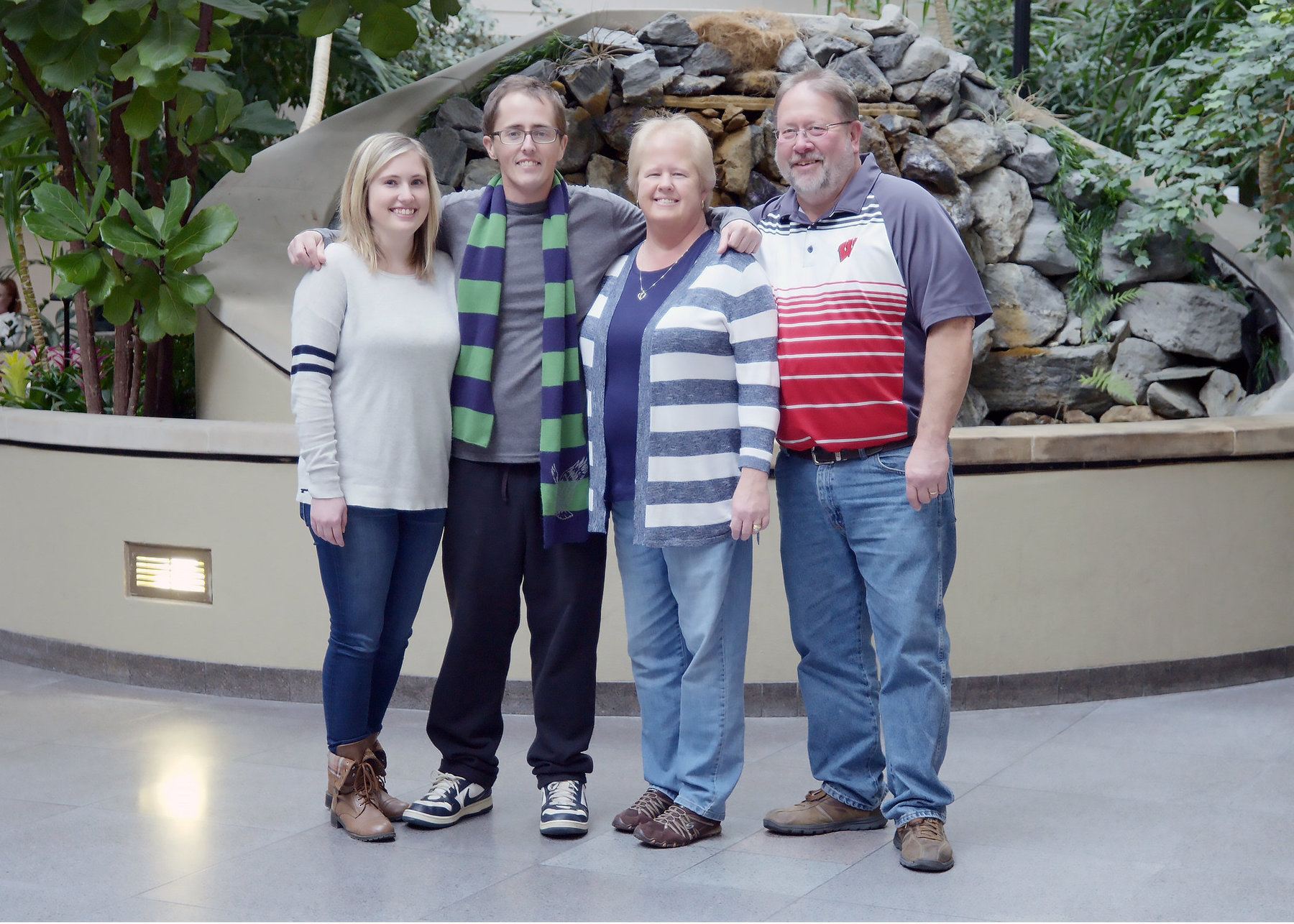 Cody is pictured here with his sister, mother and father.