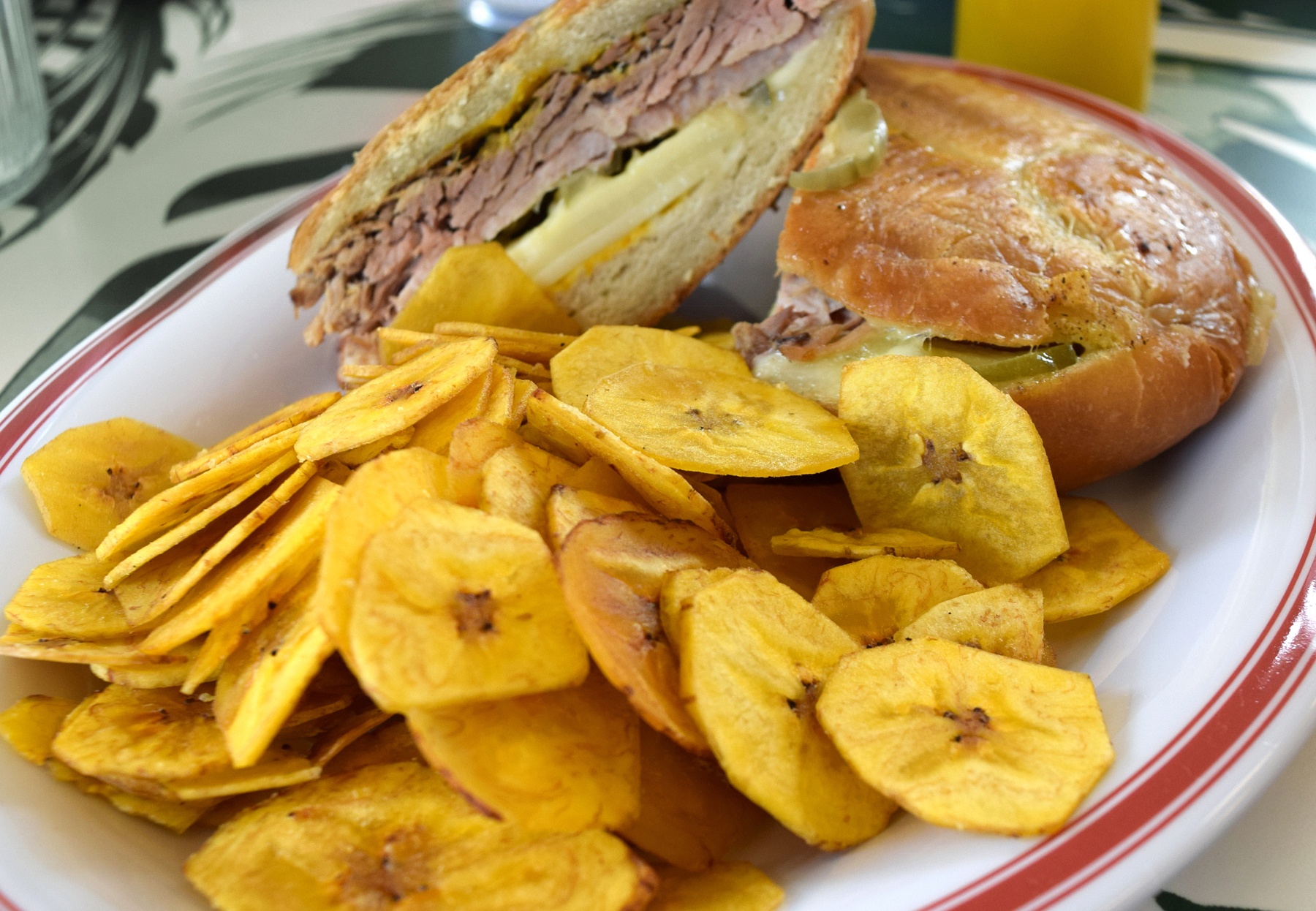 The Cuban sandwich at The Liquor Store is the real deal. Slow roasted pork is served with traditional sliced ham, Swiss cheese, dill pickles and yellow mustard on house-made Cuban bread with a mound of crispy plantain chips on the side. The Liquor Store