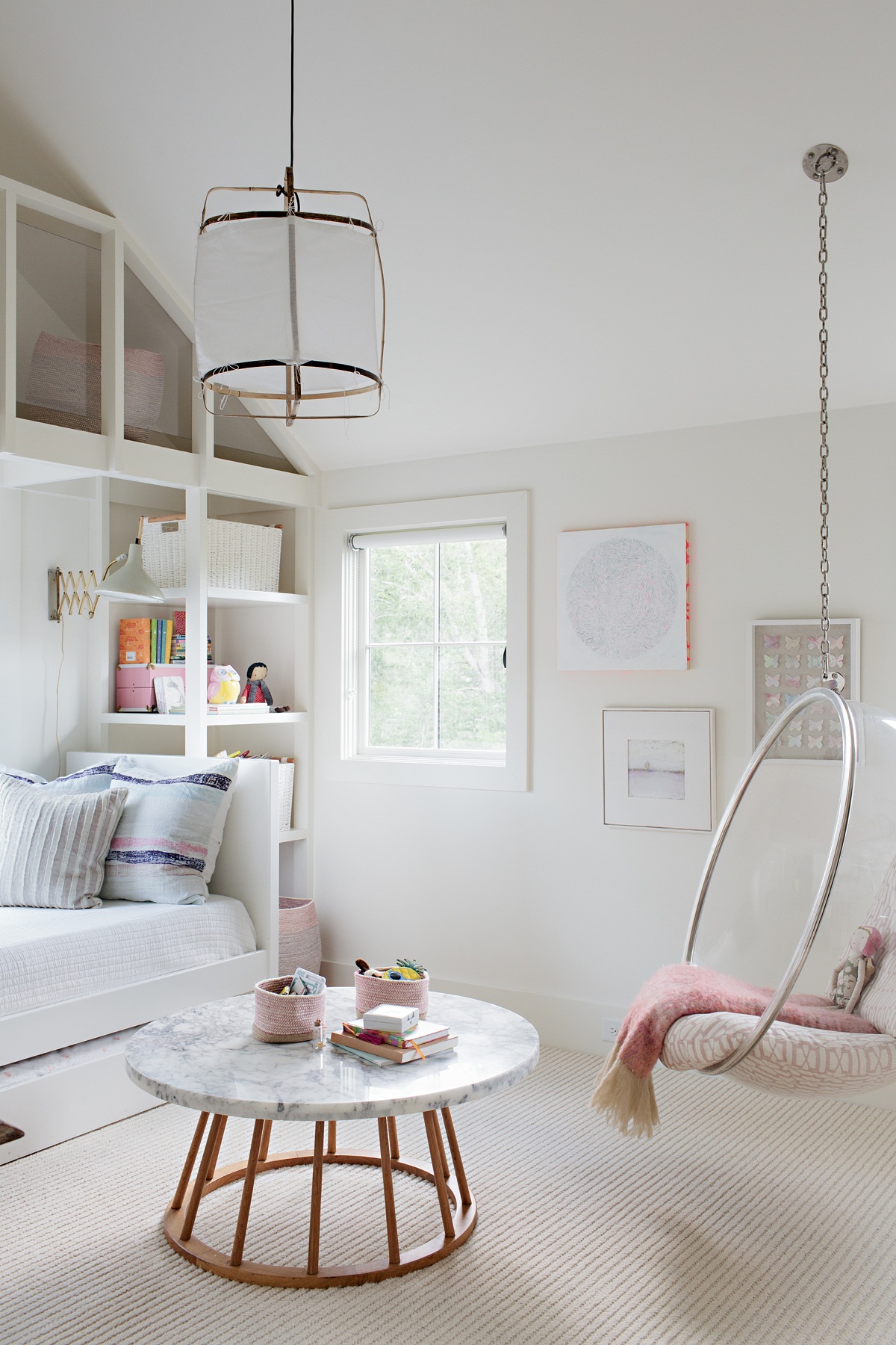 The Thrower’s daughter, Audrey, fell in love with this marble-topped coffee table and uses it as a nightstand and play table for this bedroom. "As kids exit the toddler stage, they often look for a play surface as opposed to playing on the floor. Low tables in a child’s bedroom or play space are great at this age," says Fran. Scandinavian-style family home