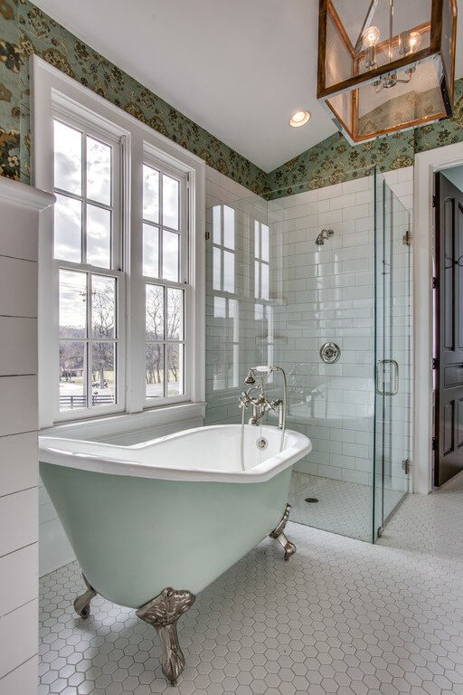 The clawfoot tub gives a nod to the past, while the sleek glass-enclosed shower is the most modern of amenities.