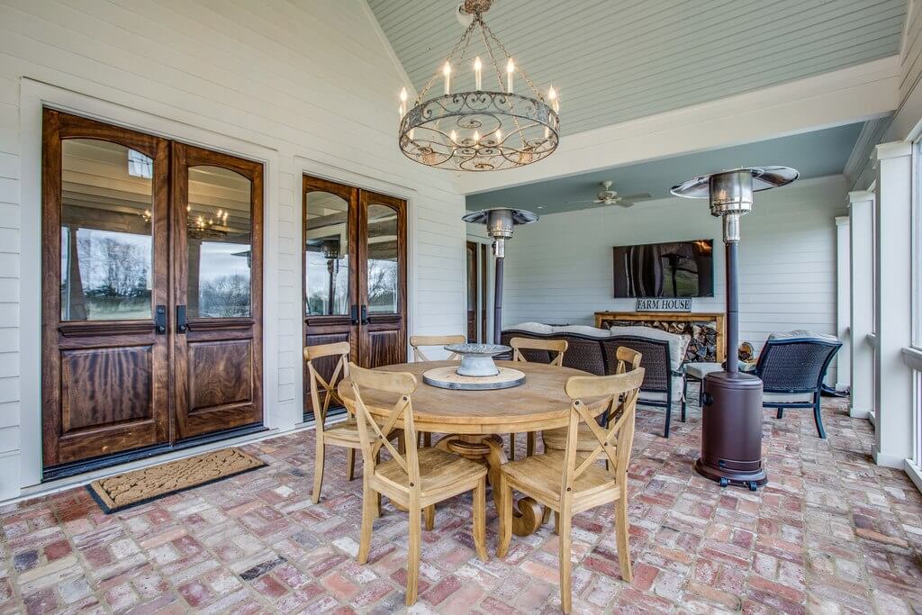 The outside porch, complete with reclaimed bricks, is perfect for an al fresco meal or for watching the game.