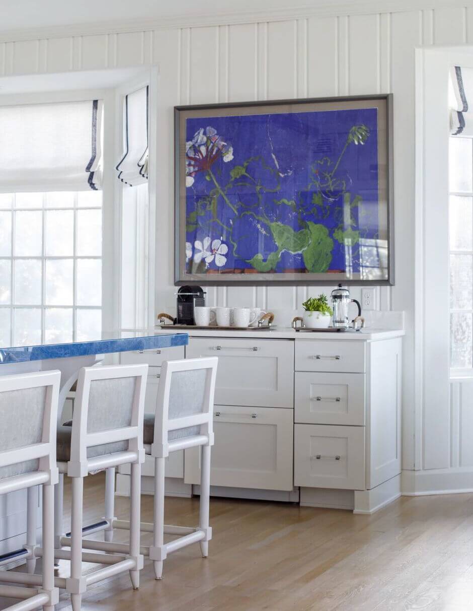 “The cabinetry below the art hosts a coffee bar, which is another feature we love to add to kitchens,” says Amy. The coffee bar contains refrigeration drawers as well as storage. Ponte Vedra kitchen