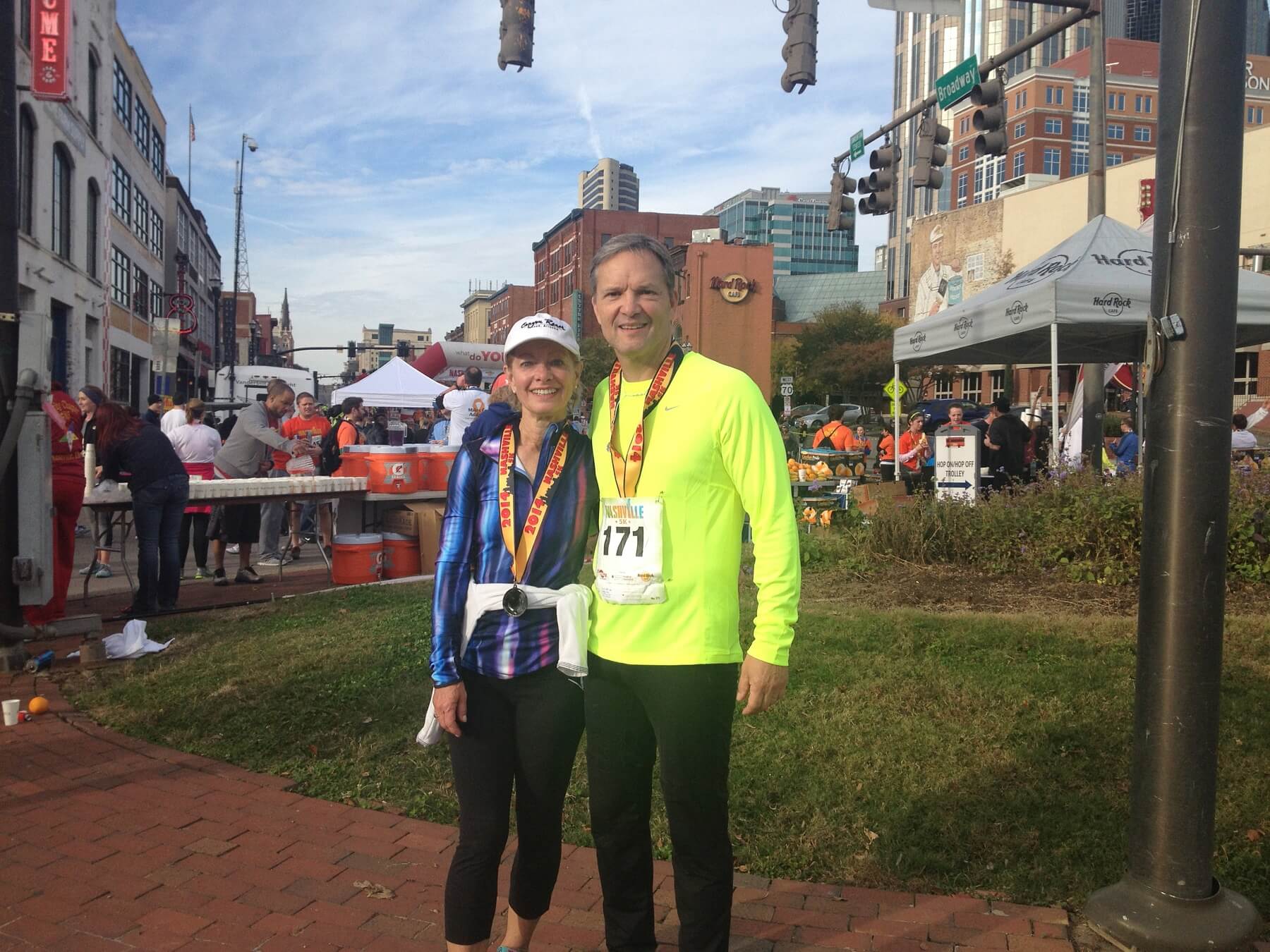 Pam and her husband finishing up a 5K in Nashville, something they enjoy doing and have the time to do!